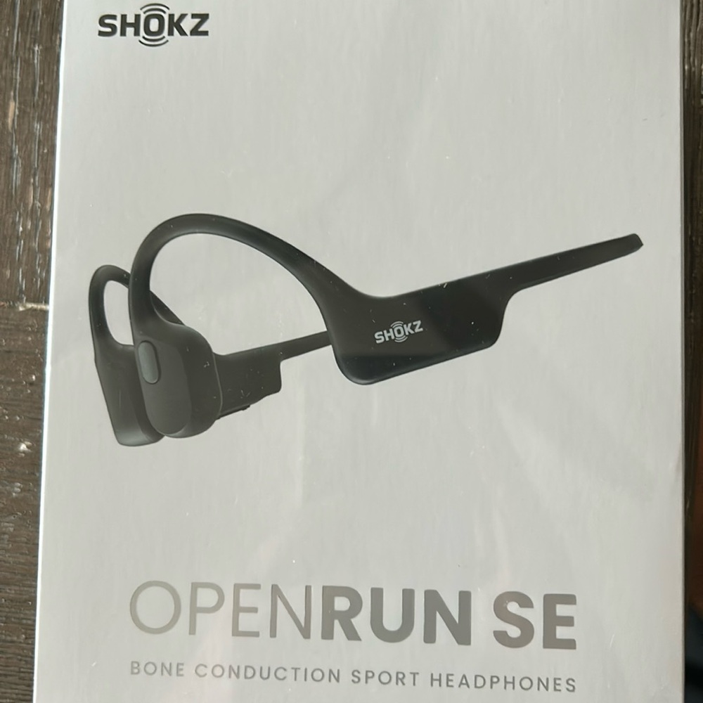 New opened box Shokz OpenRun SE headphones. Born construction sport headphones.